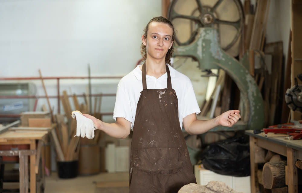 Young guy posing in taller workshop