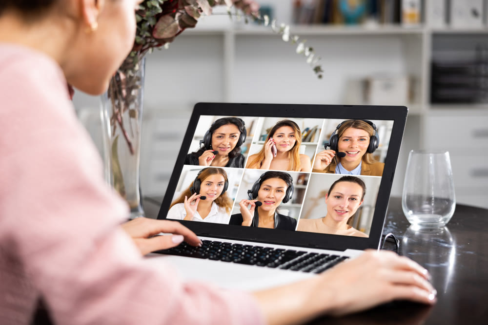 Manager holding online meeting on laptop