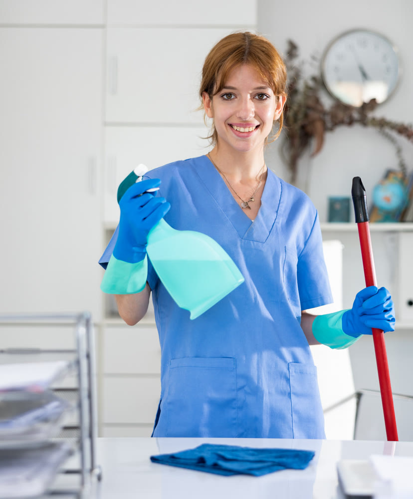 Portrait of cleaning company cleaner in office