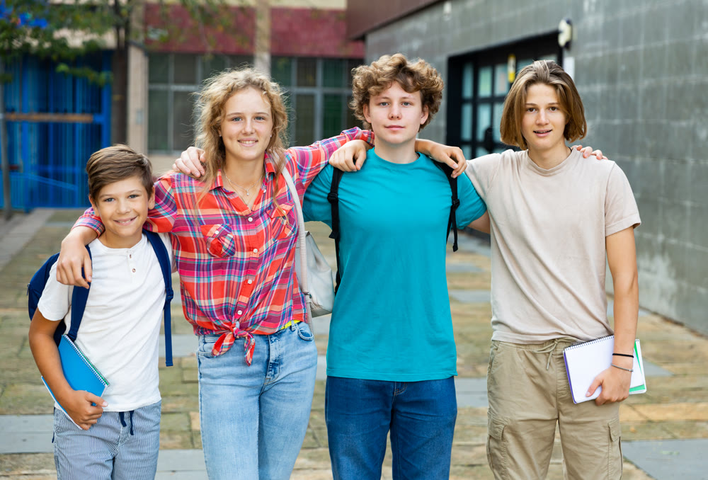 Group photo of teenagers outdoors