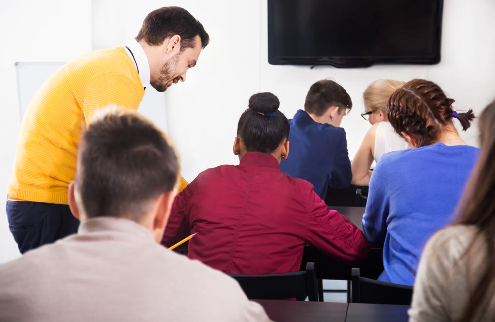 Teacher explaining difficult problem to student