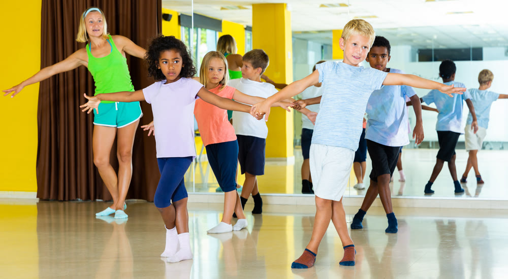 Children practicing jive movements