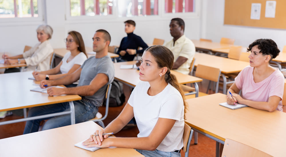 Attentive university students in advanced training courses in auditorium