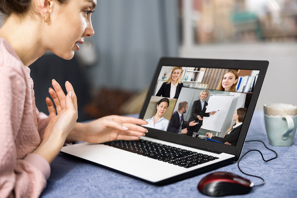 Manager holding online meeting on laptop
