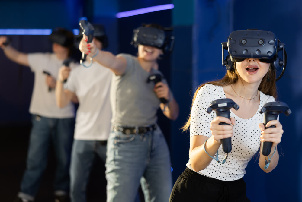 Friends using virtual reality glasses - people having fun with technology vr headset