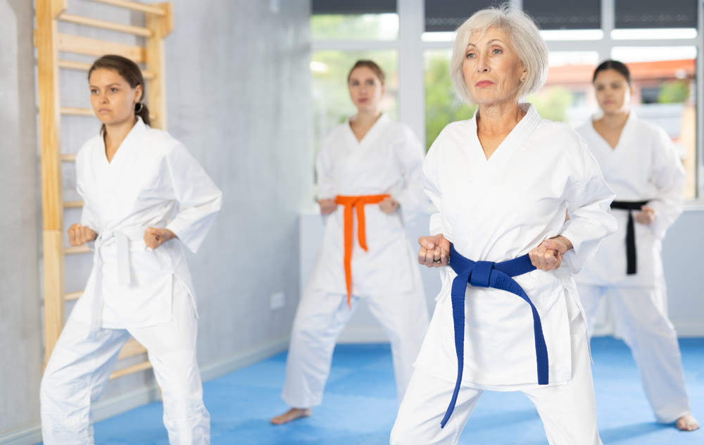 Athletes have starting position and repeating sequence of punches and painful techniques in kata