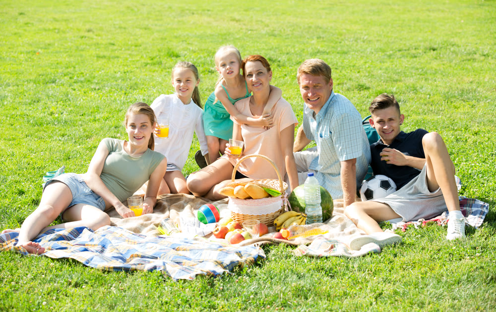 Parents with kids having picnic