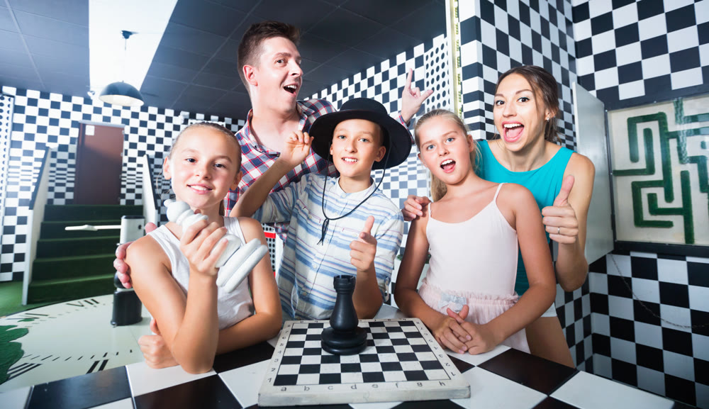 Family of five is satisfied of visit together of lost chessroom.