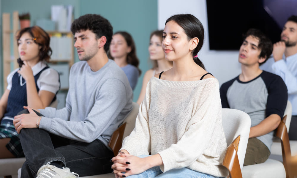 Young people are listening to lecture in auditorium