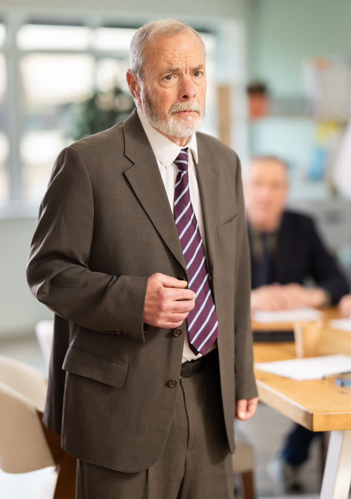 Upset senior man conference participant or partner is reprimanded