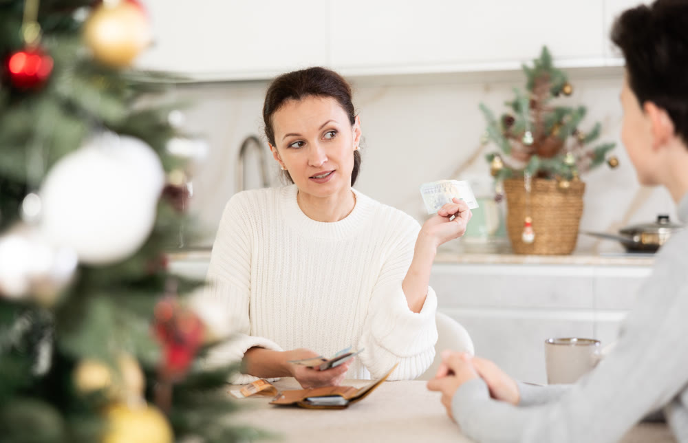 Mom gives pocket money to teenage boy before celebrating Christmas