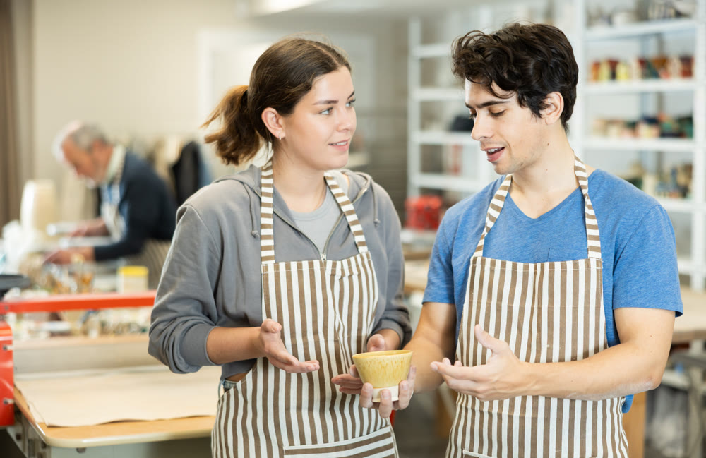 Two young masters share the joy of their work creating clay pottery
