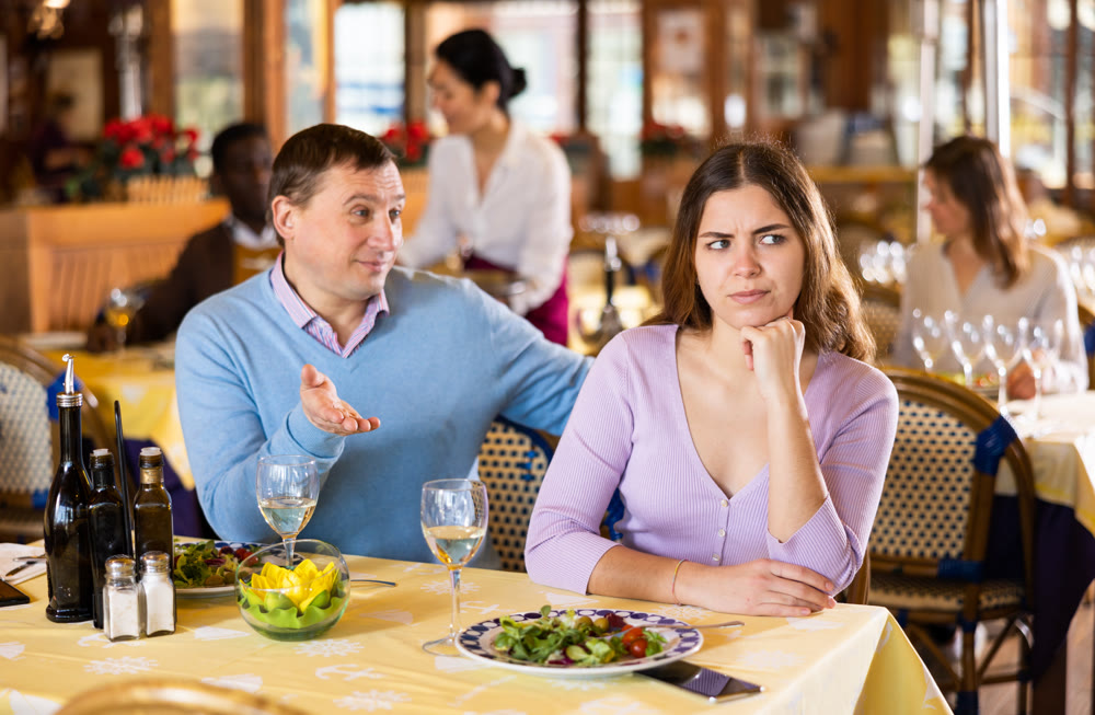 Man and his wife quarreling in restaurant