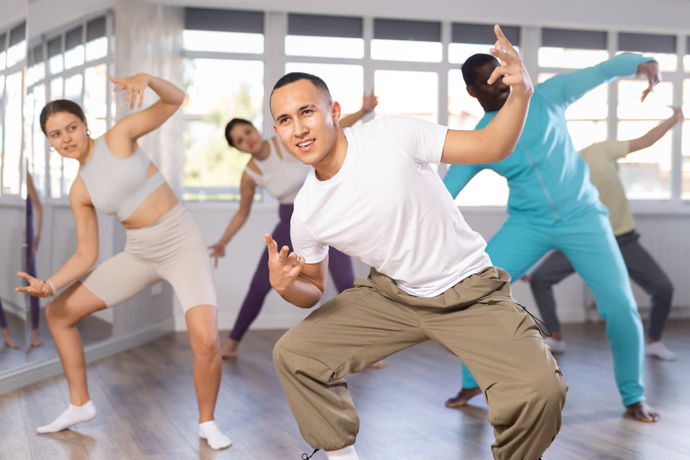 Young Asian man practicing modern street dancing in studio