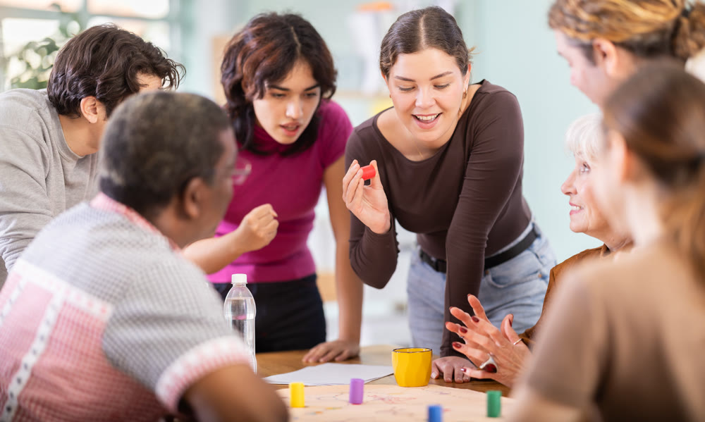 Group of people playing board game