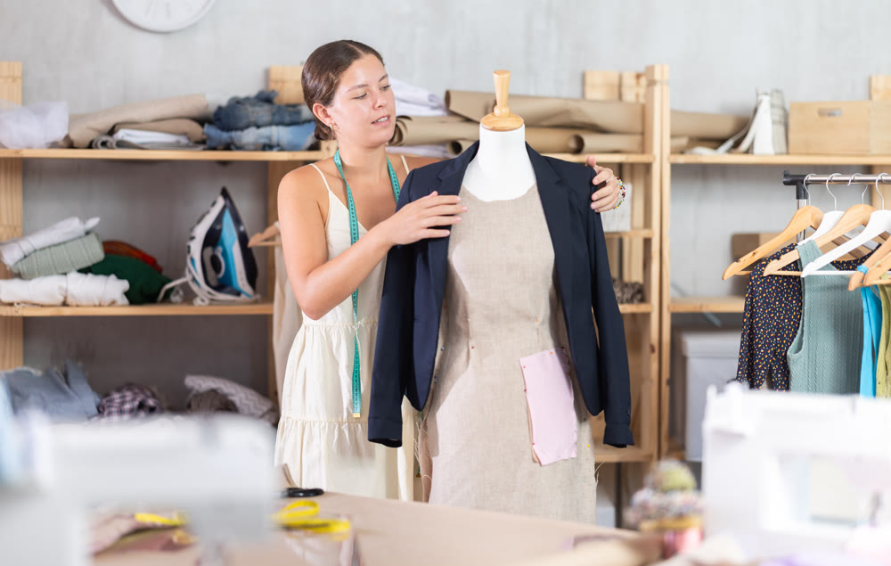 Woman dressmaker with a ready-made jacket