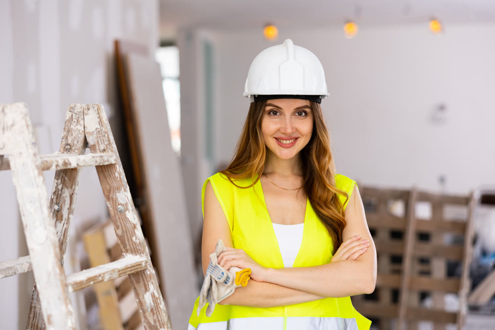 Portrait of a young seductive woman engineer in uniform