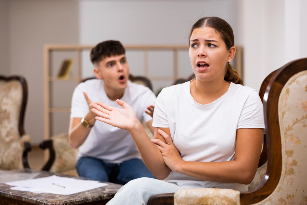 Disgruntled young husband swears at his wife