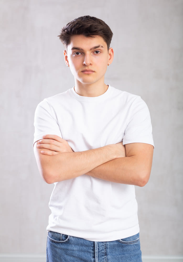 Portrait of man in casual clothes posing in studio