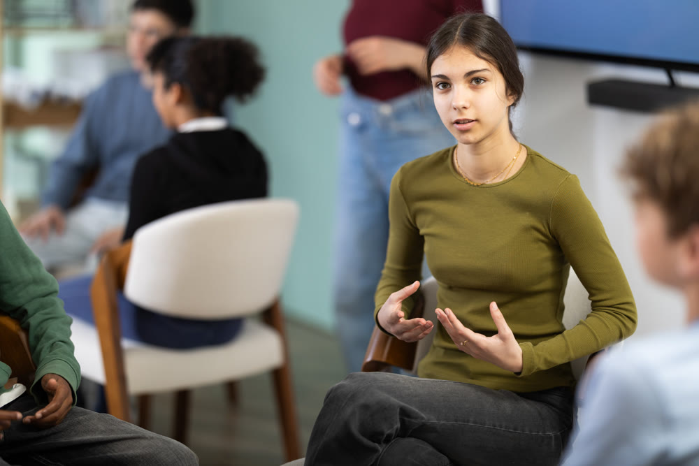 Teenage girl participating in group communication