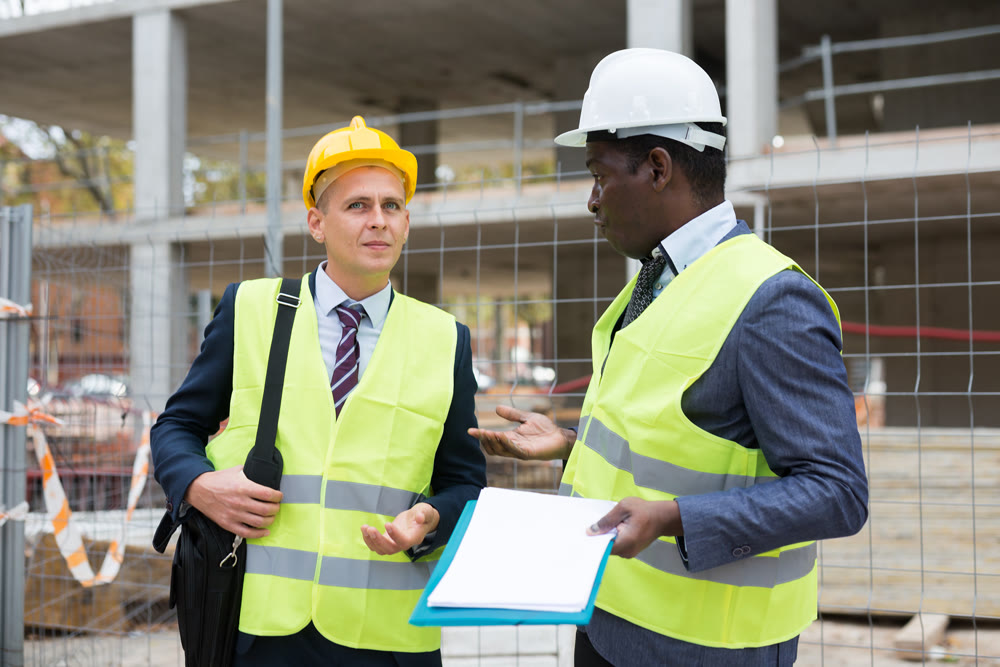 Two architects discussing construction project