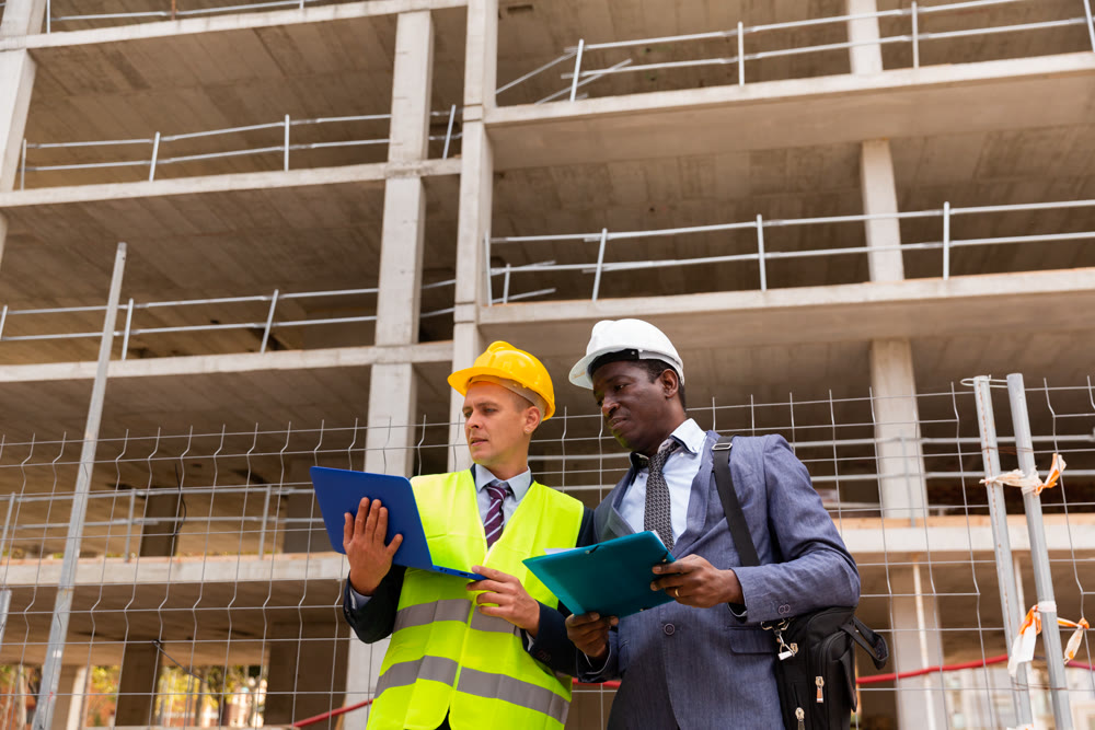 Builder and architect discussing construction