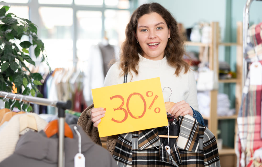 Woman rejoices at the start of sales in the store