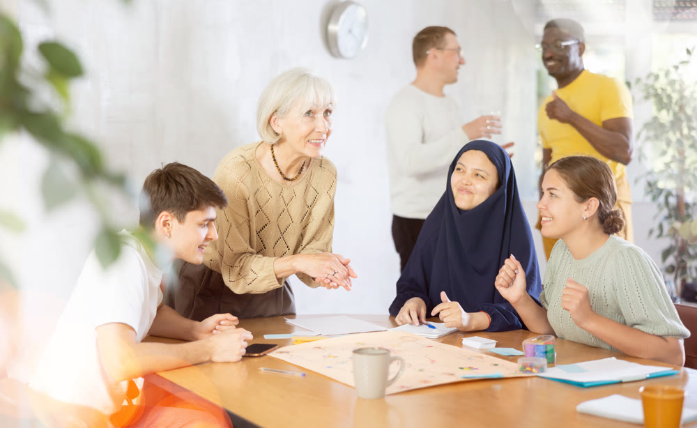 Smiling elderly woman playing board game with friends