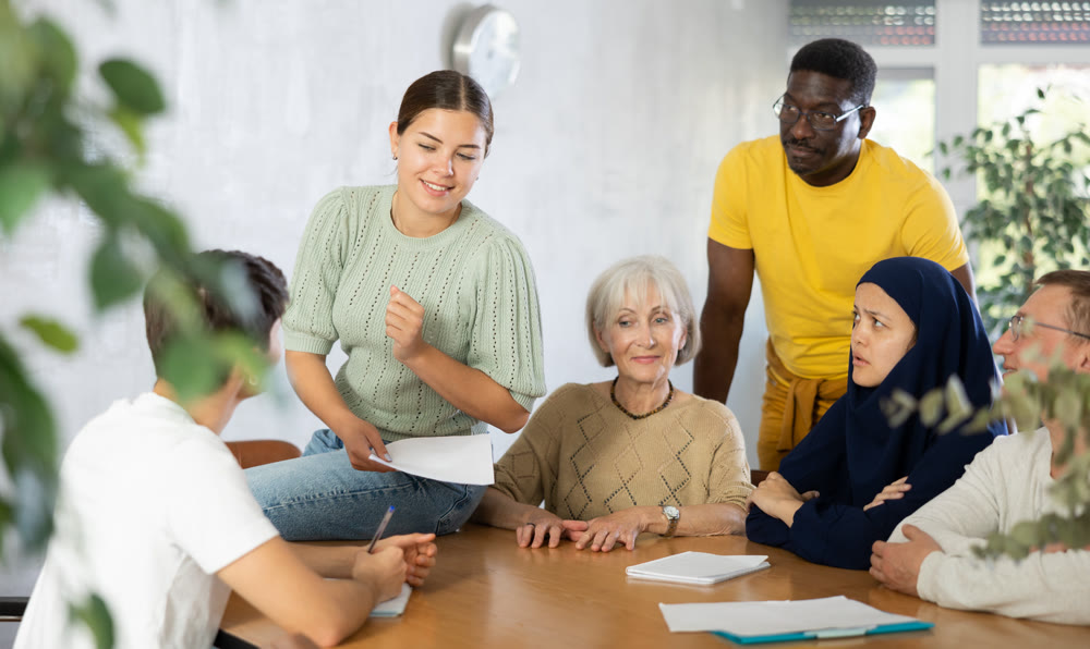 Group adult students different ages and multinational discussion during business course