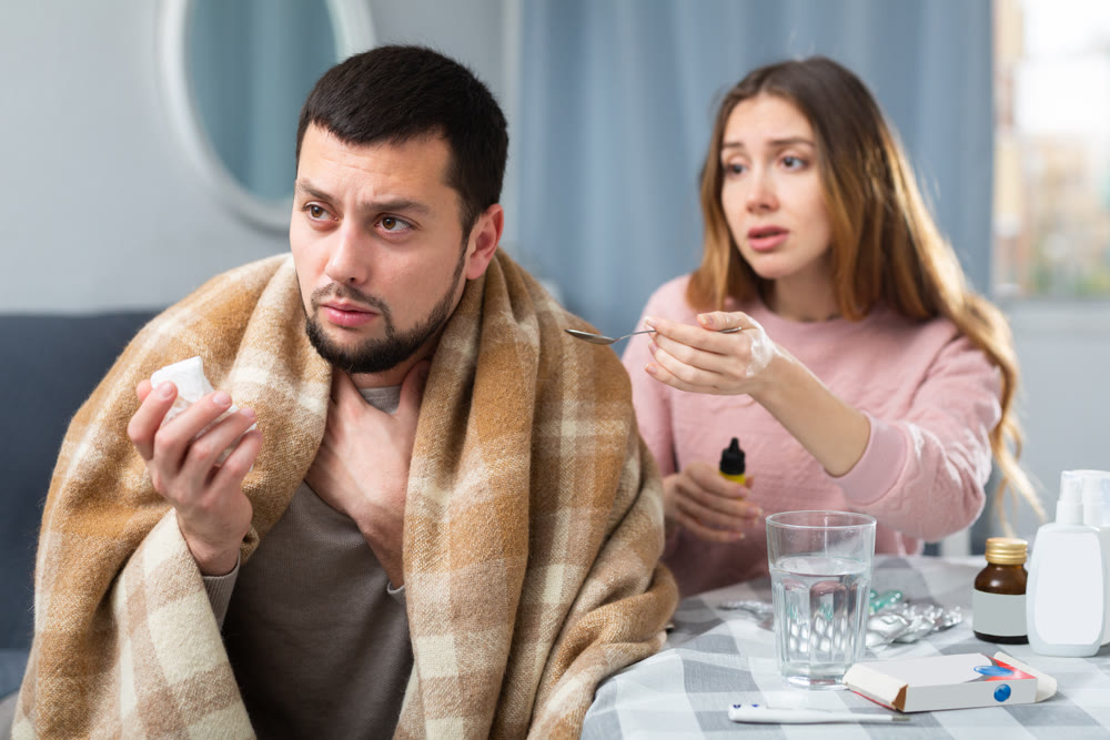 Woman taking care of her ill husband at home