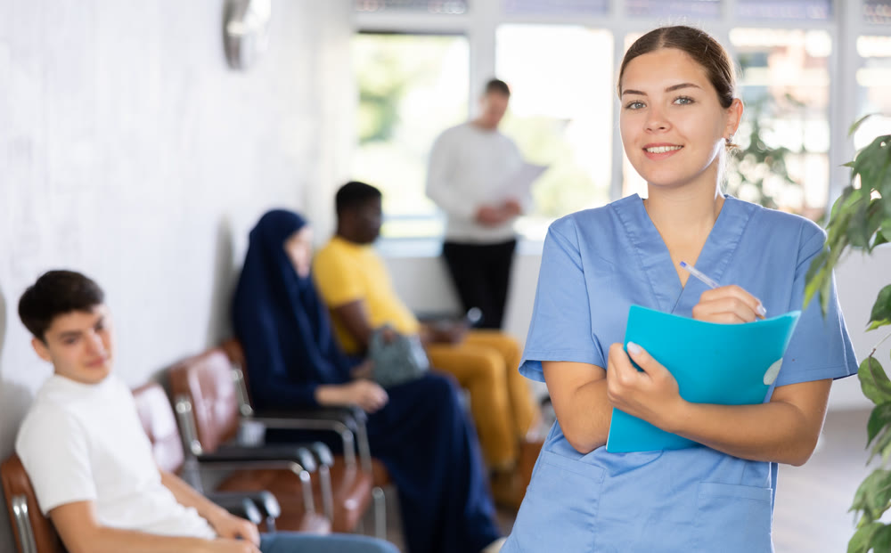 Young woman in medical uniform making notes