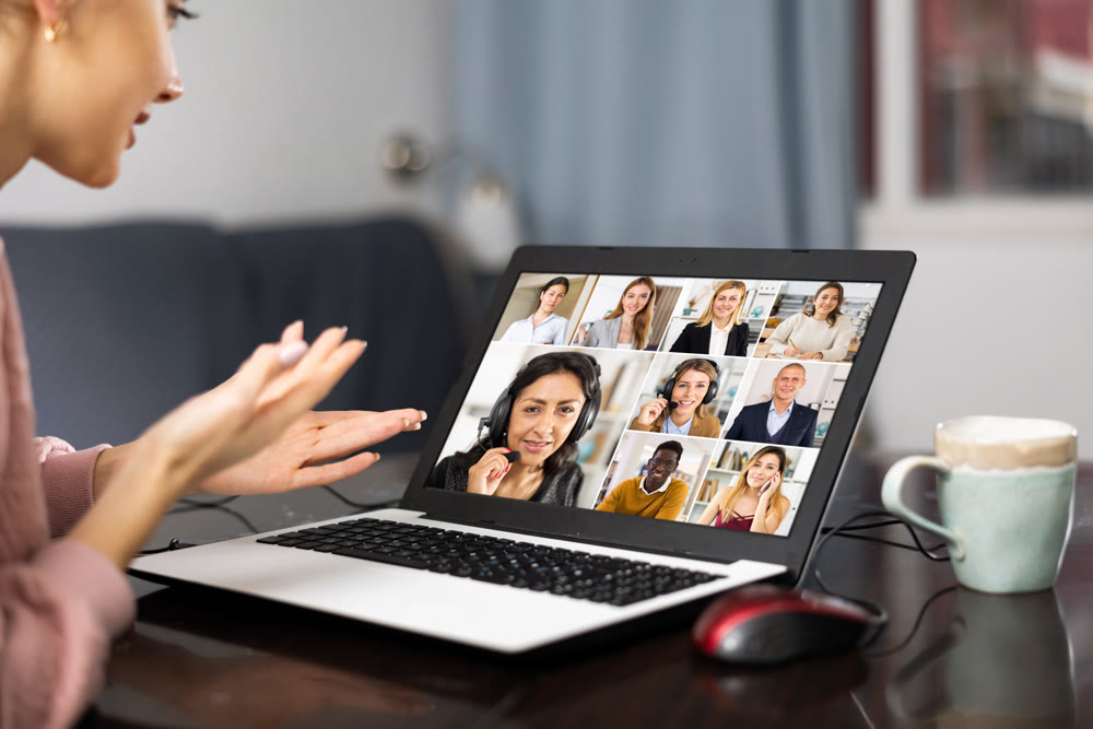 Woman having video conference with colleagues