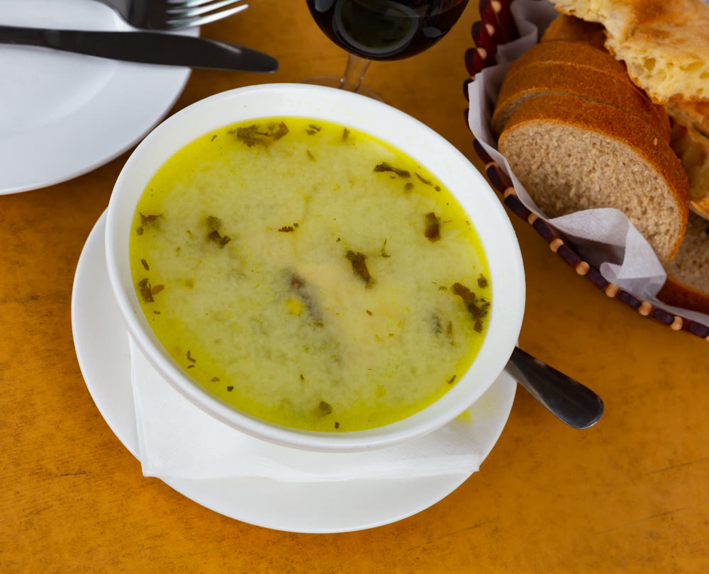 Traditional Georgian chicken soup Chikhirtma in white plate