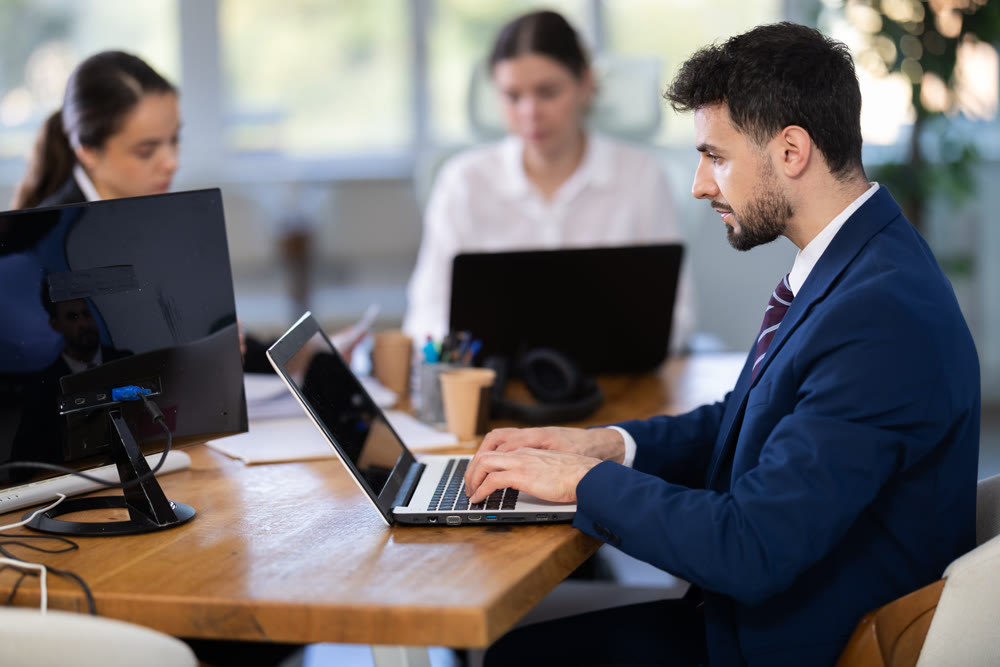 Group of young colleagues working in office