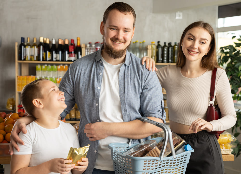 Man with wife and son shopping in grocery store