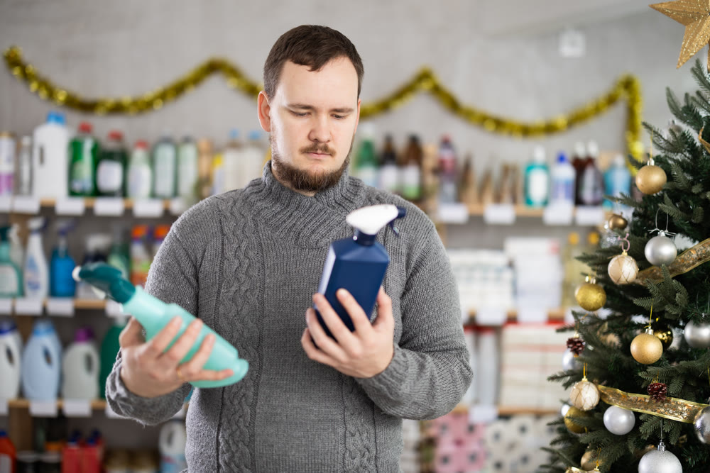 On New Year Eve, man choose and buy kitchen cleaner spray