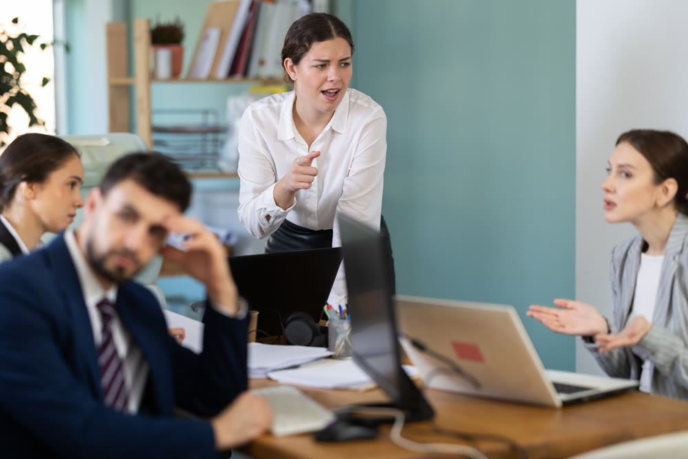 Angry woman shouting at team