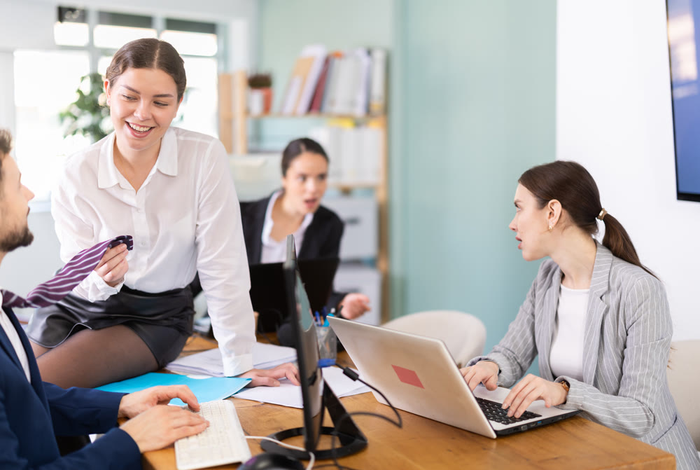 female employee of the company flirts with a male employee