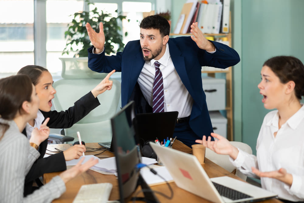 Team of employees got into an argument during an office meeting