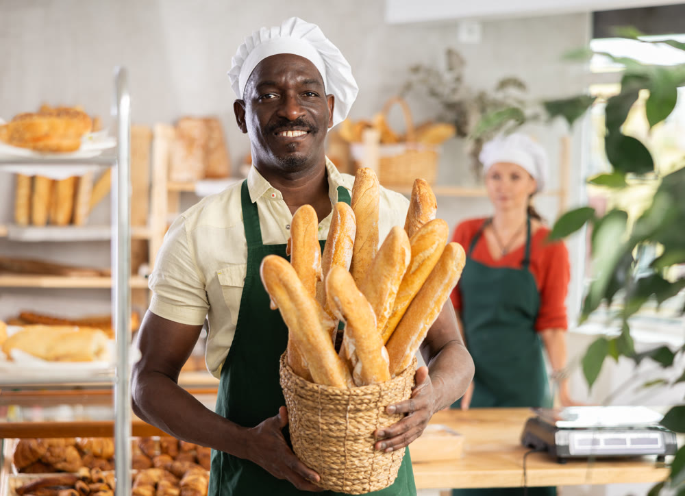 Portrait of positive man bakery worker
