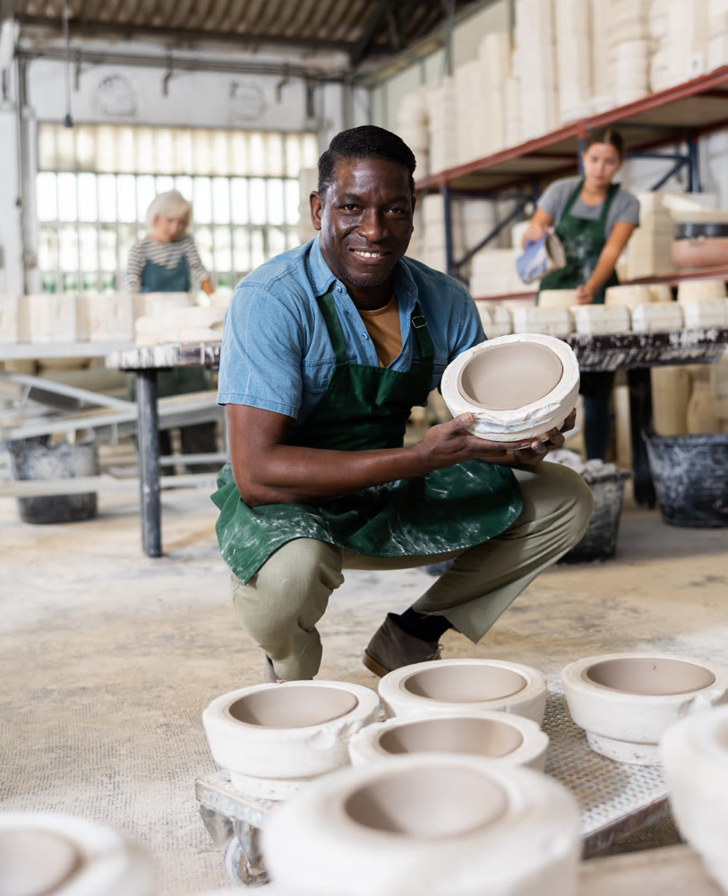 Positive man potter with mould for new ware