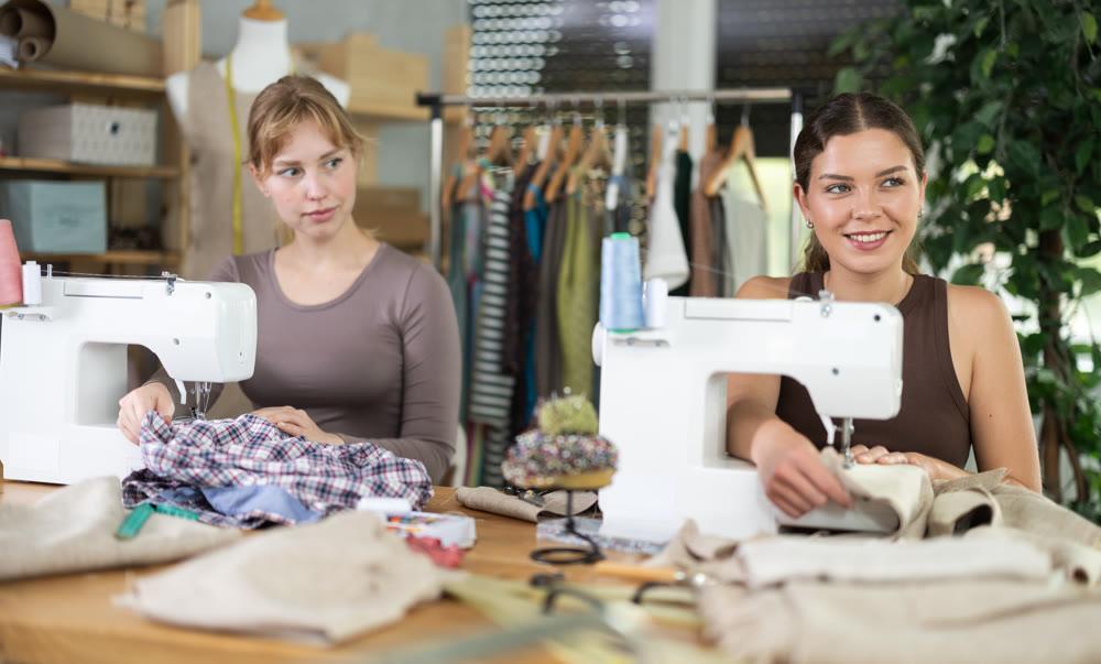 Two female tailors working in the workshop