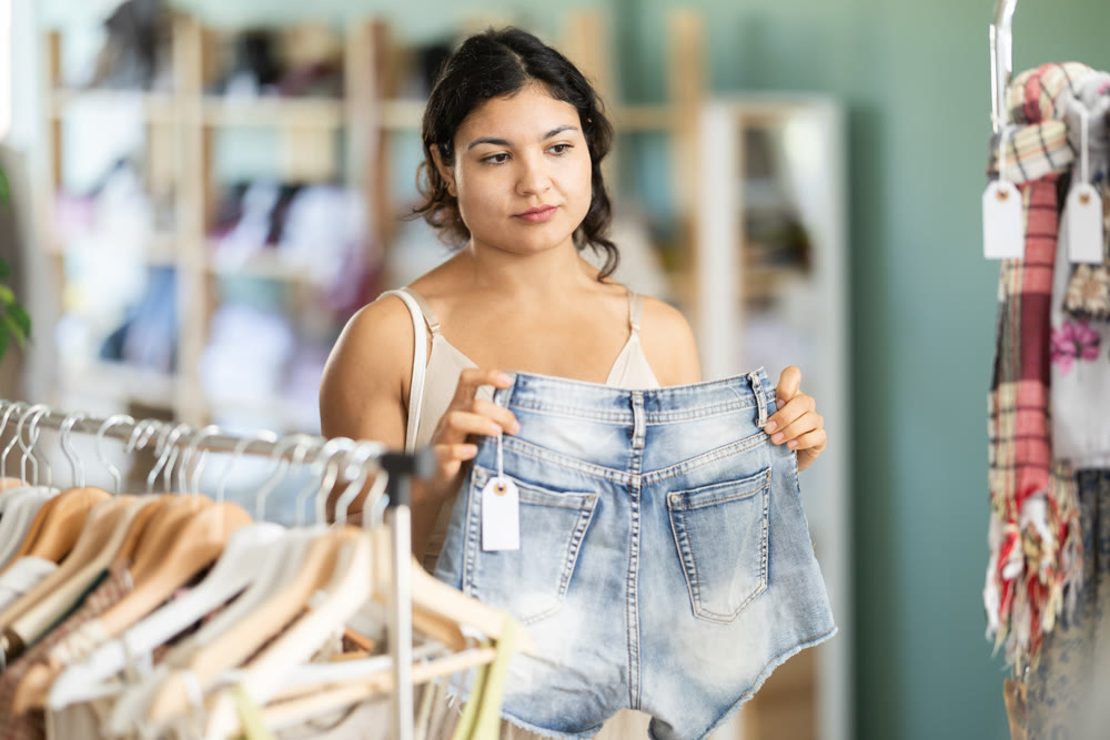 Girl at trading floor pick out and buying shorts