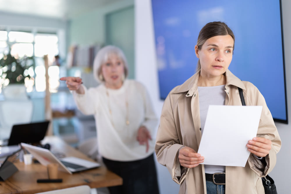 Dissatisfied female director of company throws female manager out of office