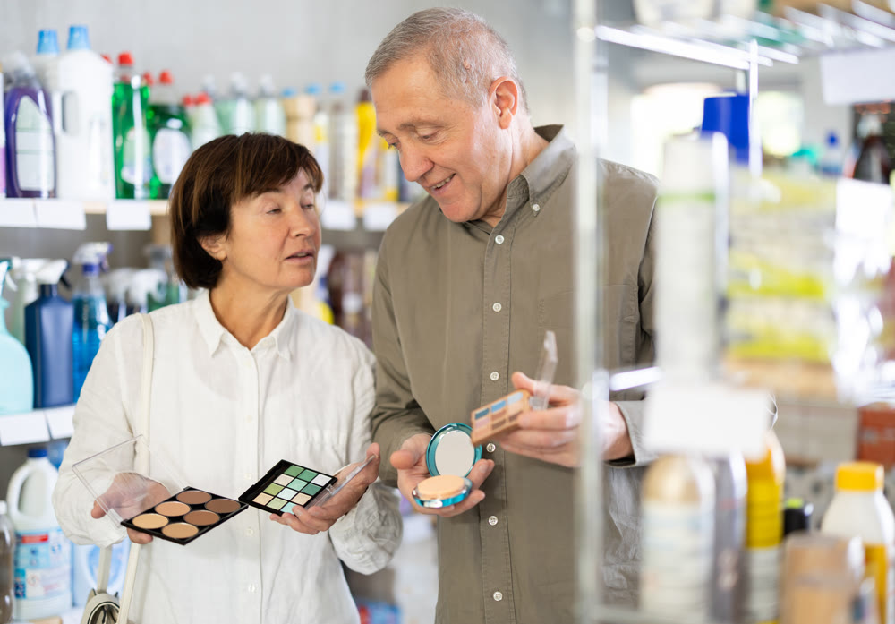 Couple man and woman choosing cosmetics in store