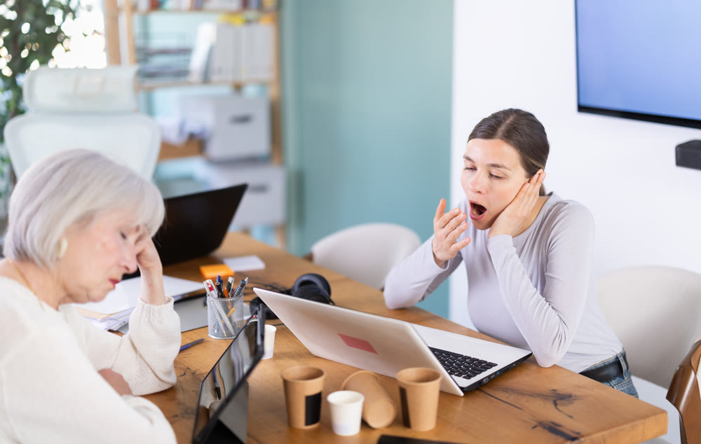 Tired businesswomens sleeping in the office with her head on table