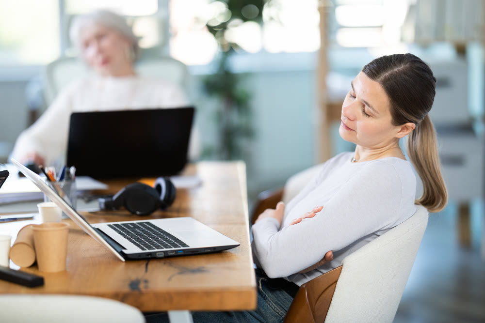 Tired businesswomens sleeping in the office with her head on table