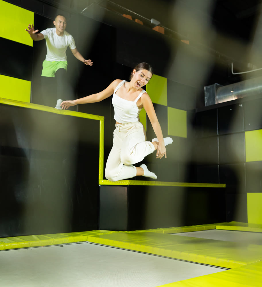 Woman sportswoman fitness jumping on club trampoline