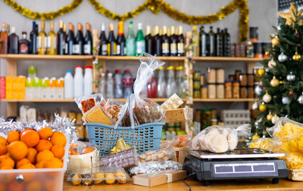 Different products in basket on counter of grocery store