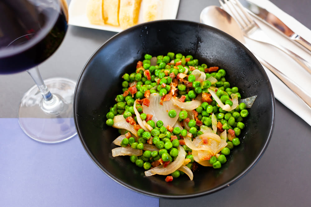 Appetizing dish of peas with ham